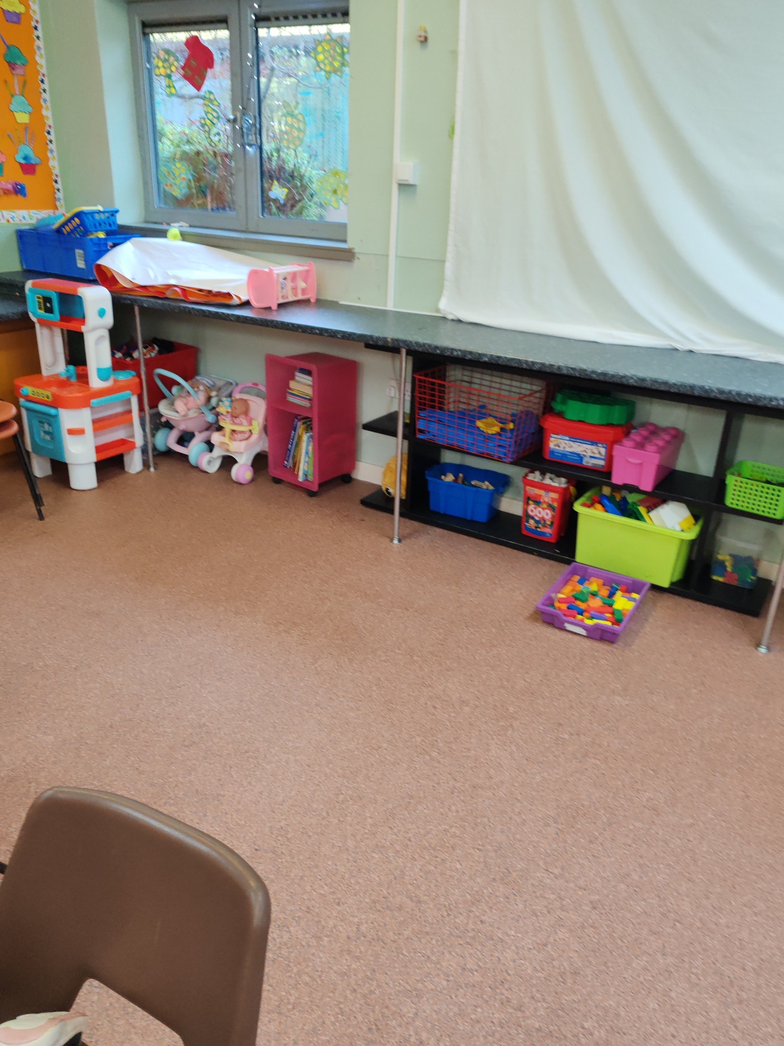 Play area with toys and storage at the COJAC Centre